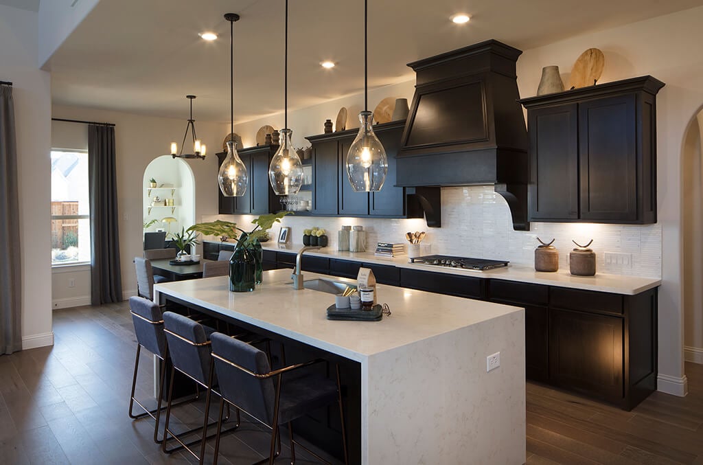 Photo: Dark finish cabinets offer plenty of storage. 