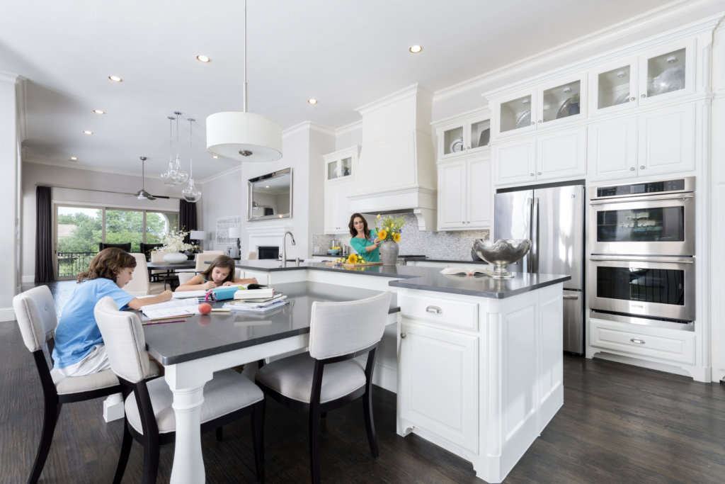 A spacious open-plan kitchen is the perfect setup for mom and kids to share homework time together.