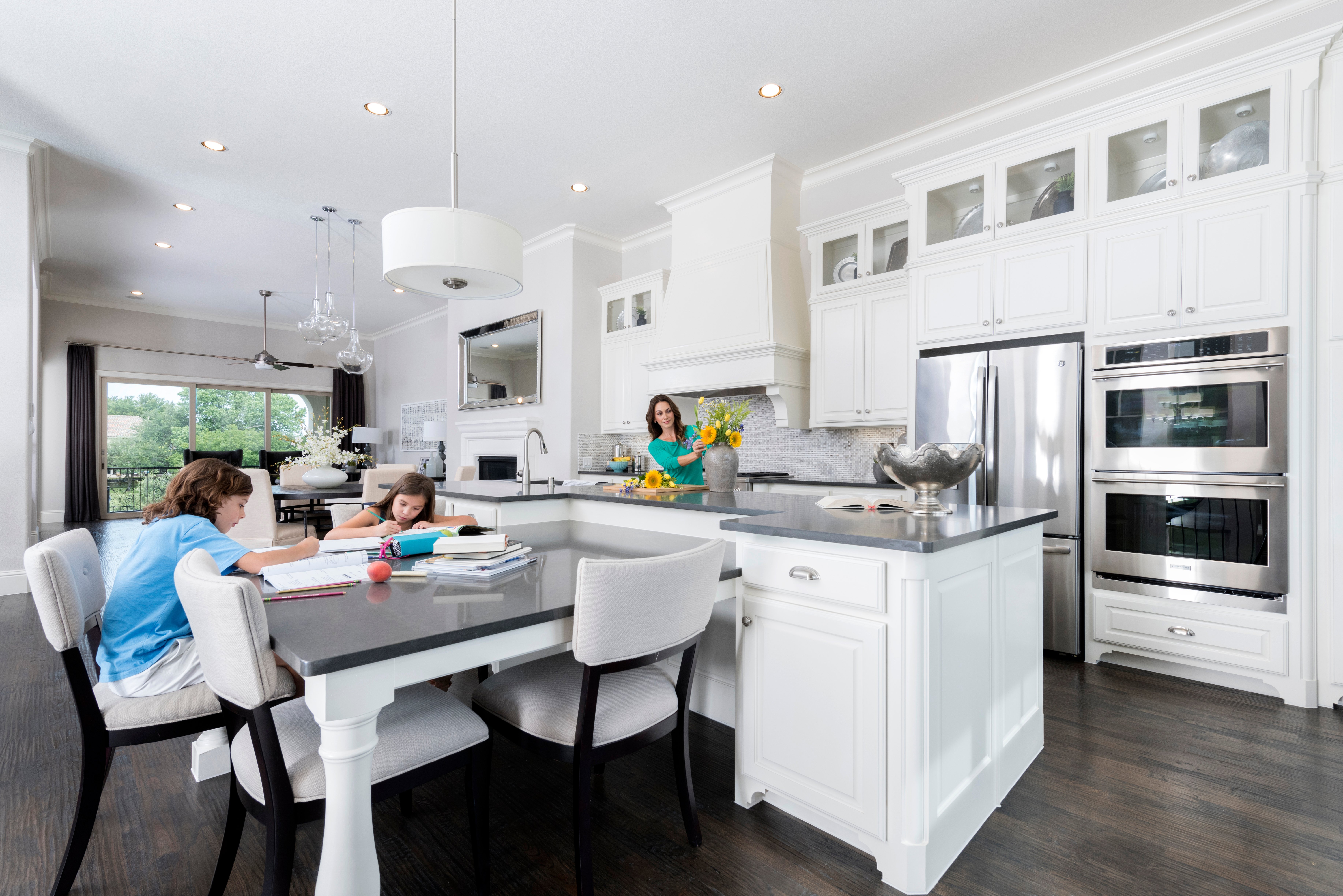 A spacious open-plan kitchen is the perfect setup for mom and kids to share homework time together.
