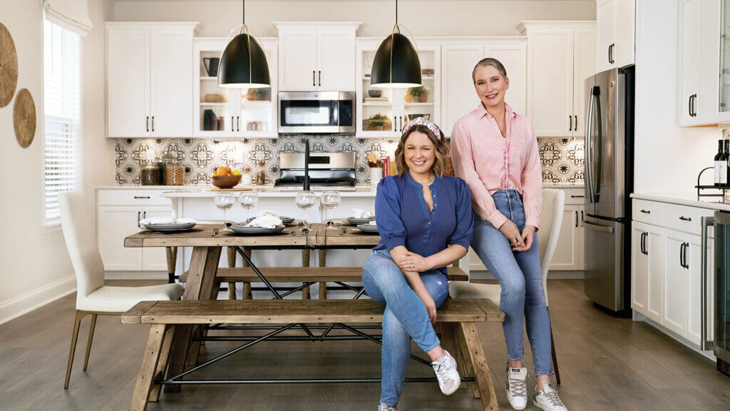 Clea and Joanna of The Home Edit posing in a Taylor Morrison kitchen
