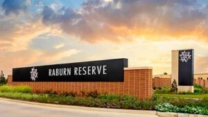Official signage for the Raburn Reserve neighborhood, showcasing a premium home community in Tomball’s 77375 ZIP code