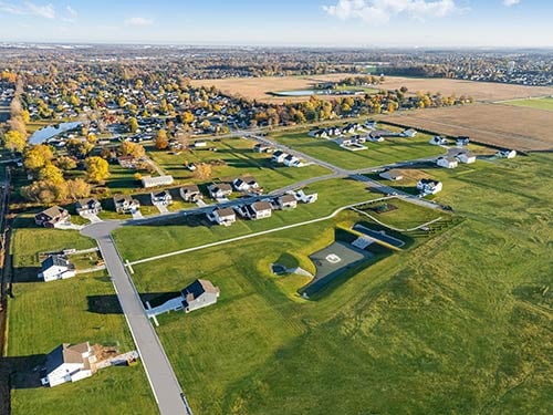 Bird’s-eye view of Grand Oaks residential community in Mooresville with homes and community green space