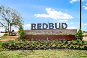 Entry signage for the Redbud community, a Taylor Morrison development in Hockley’s 77447 ZIP code