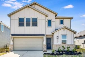 Contemporary 3–5 bedroom home in Hockley with neutral siding and brick accents located in the Redbud community
