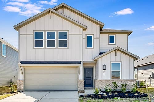 Contemporary 3–5 bedroom home in Hockley with neutral siding and brick accents located in the Redbud community